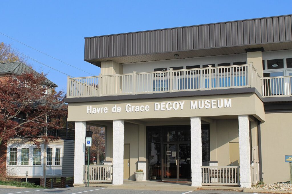The Decoy Museum's two-story entrance, with a railed balcony above square white columns